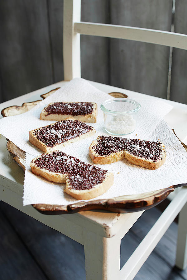 Chocolate Bread With Salt On A Wooden Chair Photograph by Rafael Pranschke