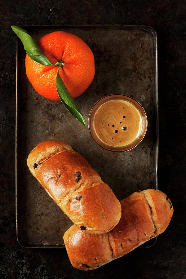 Chocolate Brioche Rolls, An Espresso And A Mandarin On A Baking Tray Photograph by Jane Saunders