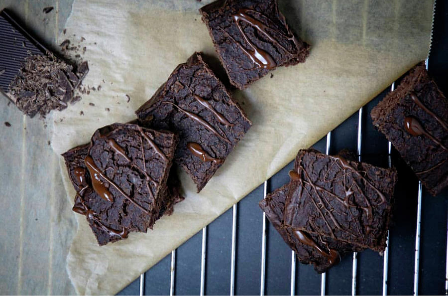 Chocolate Brownies On Baking Paper Photograph by Sarahs Foodphotos