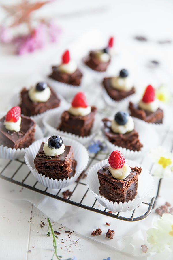 Chocolate Brownies Topped With White Chocolate Icing, Raspberries And Blueberries Photograph by Joan Ransley