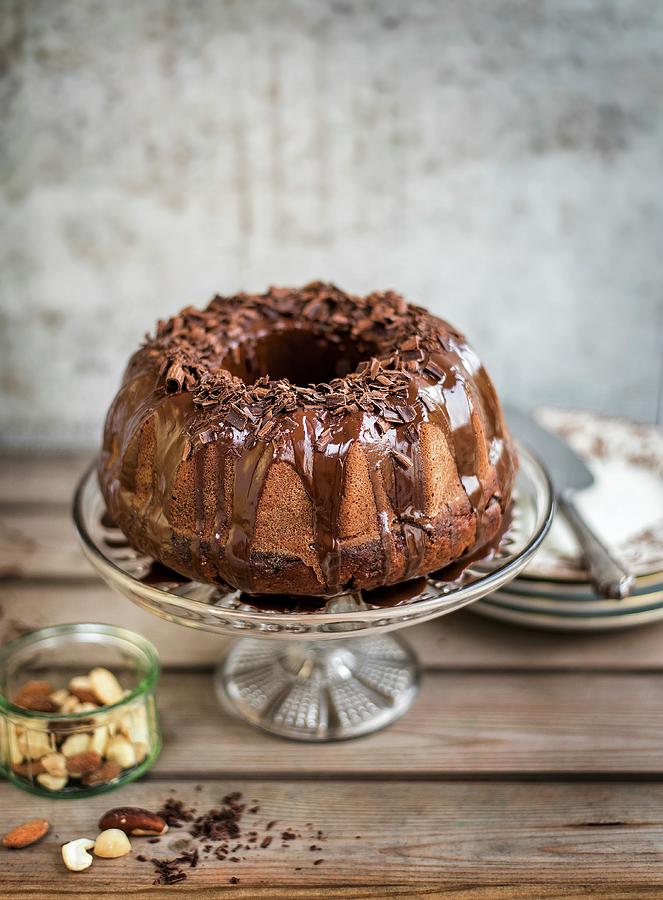 Chocolate Bundt Cake With A Chocolate Glaze And Chocolate Curls Photograph by Lucy Parissi