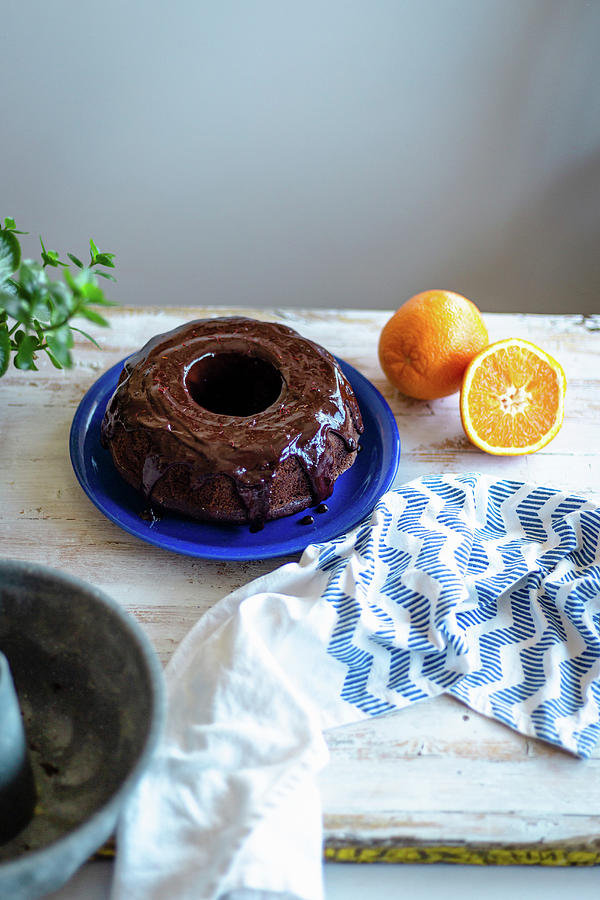 Chocolate Bundt Cake With Coconut Sugar And Orange Chocolate Glaze Photograph by Daniela Lambova
