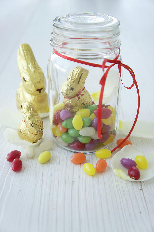 Chocolate Bunnies And Jar Of Sugar Eggs Photograph by Martina Schindler