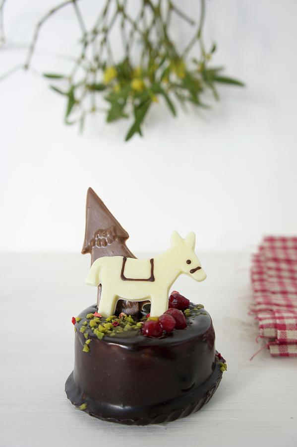 Chocolate Cake Decorated With A Donkey And A Christmas Tree Photograph by Martina Schindler