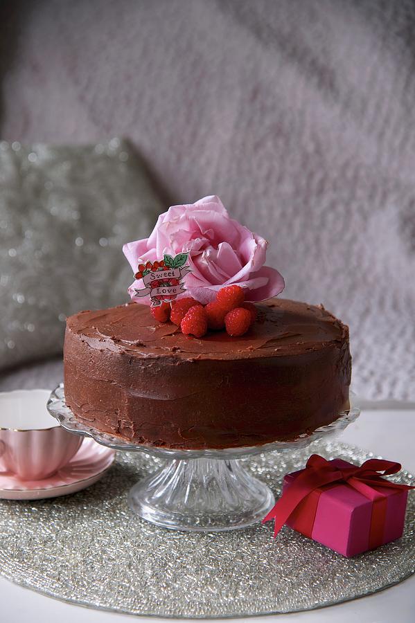 Chocolate Cake Decorated With Raspberries And Roses For Valentines Day Photograph by Winfried Heinze