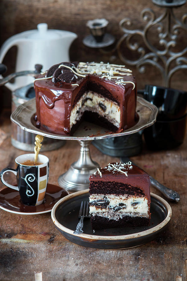 Chocolate Cake With Baked Oreo Cheesecake And Oreo Cream Photograph by Irina Meliukh