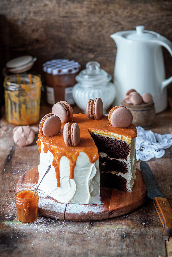 Chocolate Cake With Caramel And Macarons, Sliced Photograph by Irina Meliukh