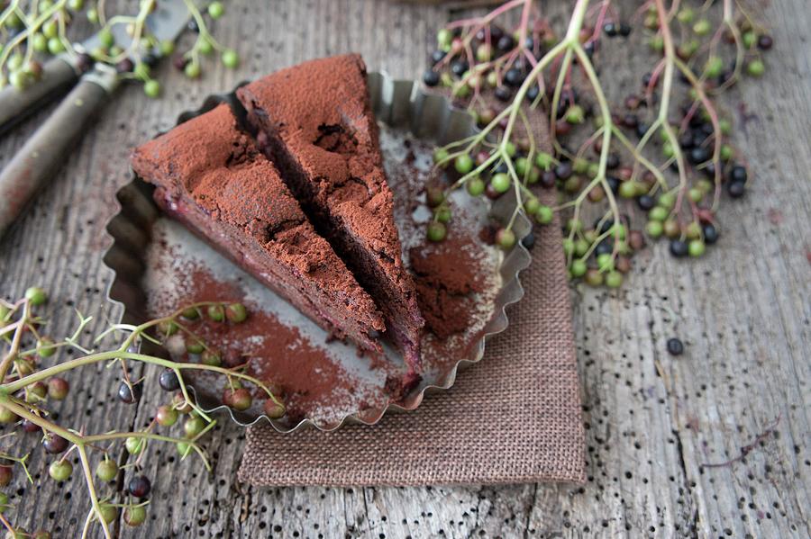 Chocolate Cake With Cherries And Elderberries Photograph by Martina Schindler