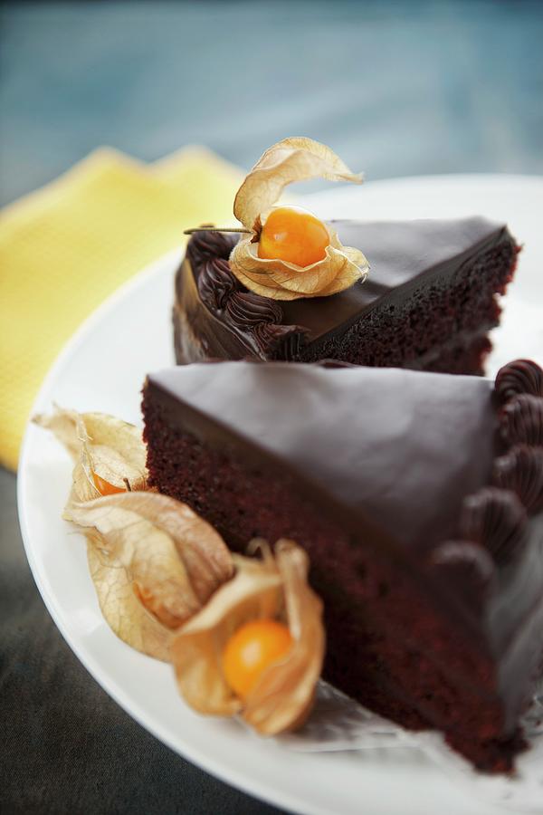 Chocolate Cake With Physalis cape Gooseberries Photograph by Yellow Street Photos