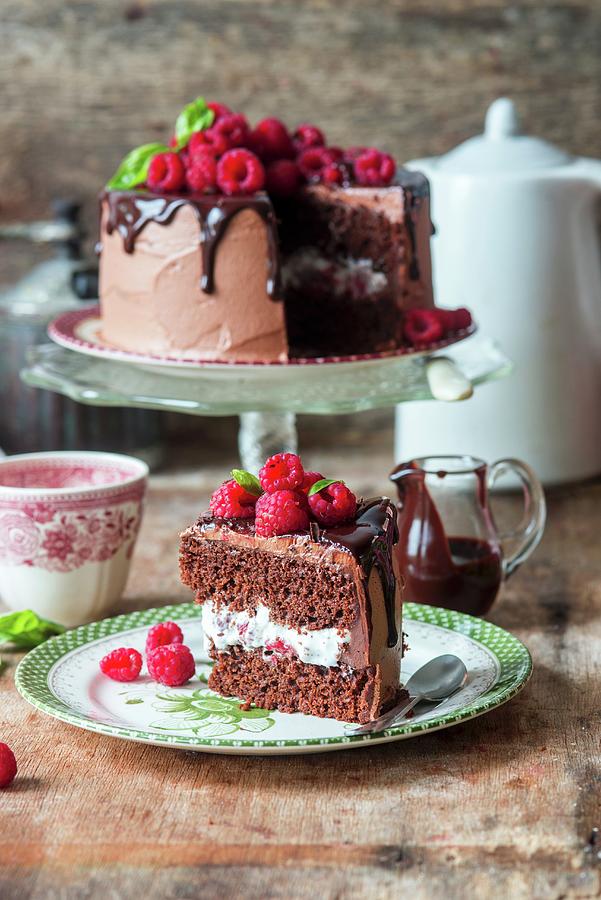 Chocolate Cake With Whipped Cream And Raspberries Photograph by Irina Meliukh