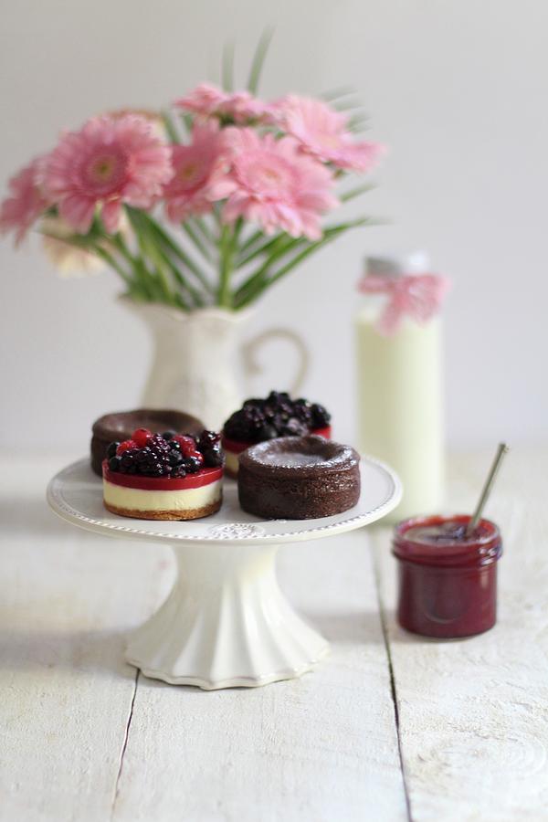 Chocolate Cakes, Berry Tartlets And A Jar Of Jam Photograph by Sylvia E.k Photography