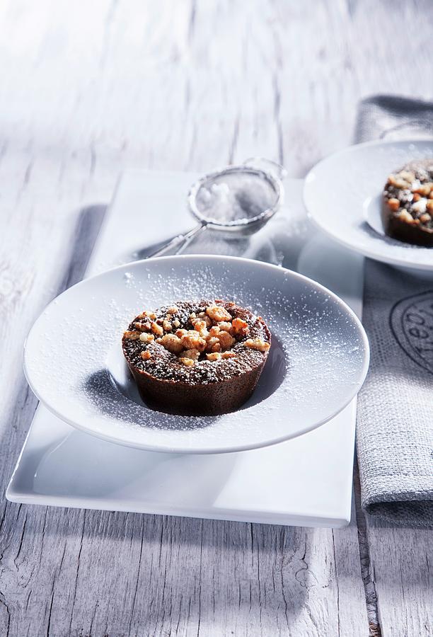Chocolate Cakes With Crumbles And Icing Sugar Photograph by Danny Lerner