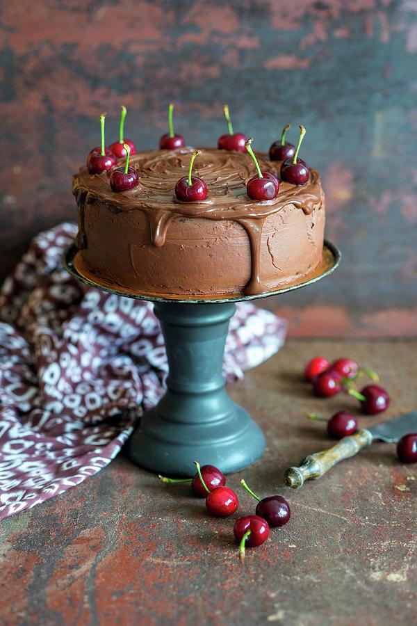 Chocolate Cherry Torte With A Slice Removed Photograph by Irina Meliukh