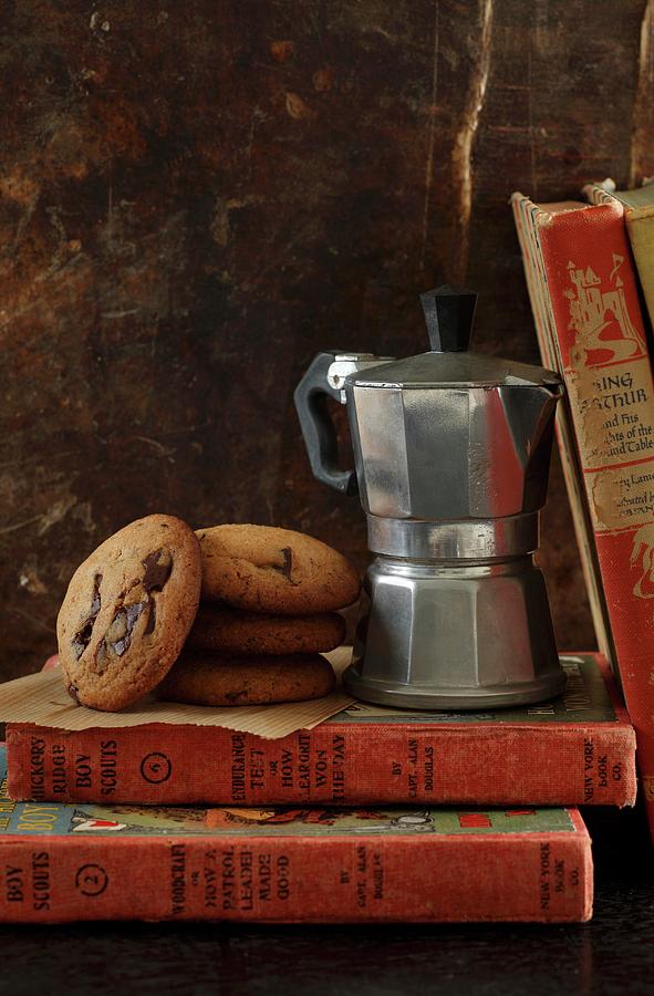 Chocolate Chip Cookies Next To An Espresso Maker On A Pile Of Old Books Photograph by Danya Weiner