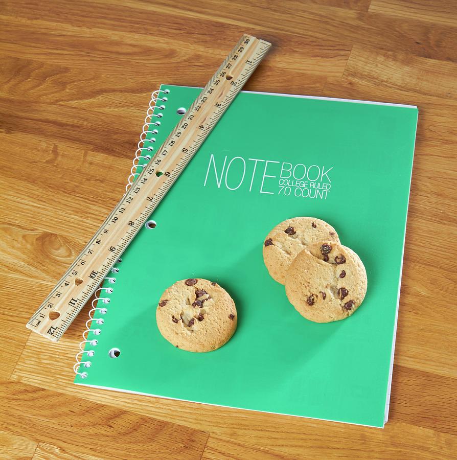 Chocolate Chip Cookies On A Notebook With A Ruler Photograph by Allison Dinner