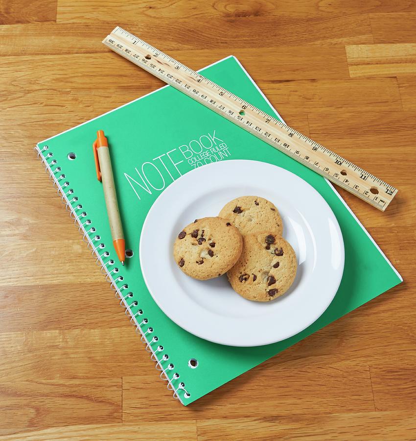 Chocolate Chip Cookies On A Notebook With A Ruler And A Pencil Photograph by Allison Dinner