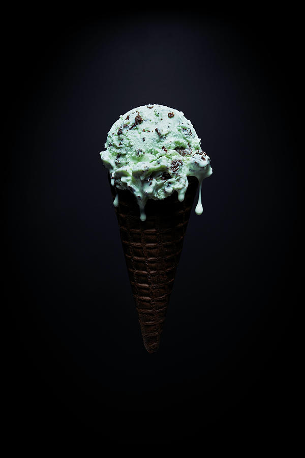 Ice Cream Digital Art - Chocolate Chip Mint Ice-cream Cone With Melted Droplets Against Black Background by Ryan Benyi Photography