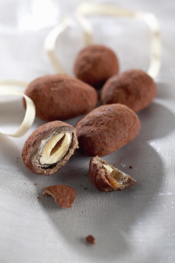 Chocolate-covered Nuts Coated In Cocoa Powder Photograph by Pizzi, Alessandra