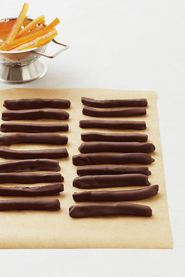 Chocolate Covered Orange Sticks In A Row Photograph by Atelier Mai 98