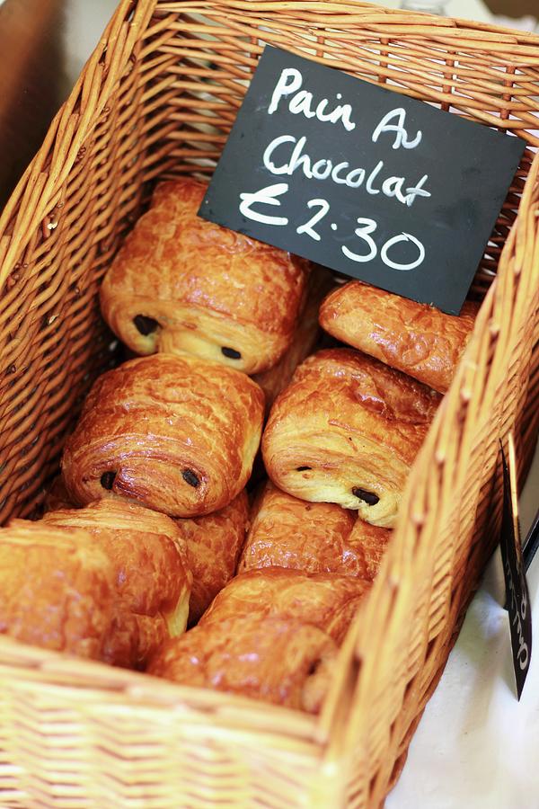 Candy Photograph - Chocolate Croissants In A Basket With A Price Tag by Langan, Neil