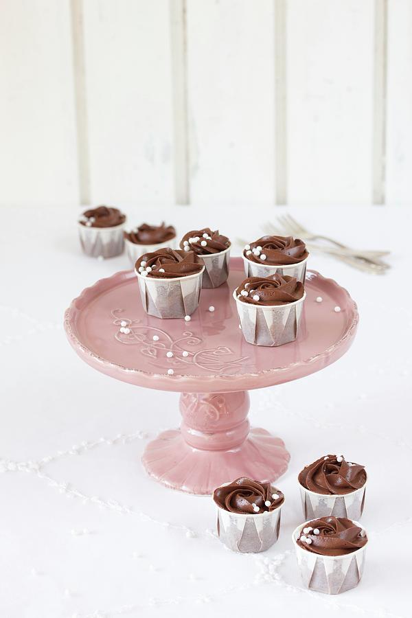 Chocolate Cupcakes On A Two-tier Cake Stand Photograph by Emma Friedrichs