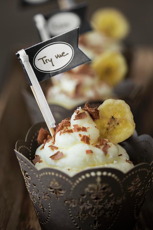 Chocolate Cupcakes With A Banana Topping In A Paper Case With A Flag Photograph by Jan Wischnewski
