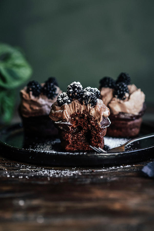 Chocolate Cupcakes With Coffee Cream And Blackberries Photograph by Kasia Wala