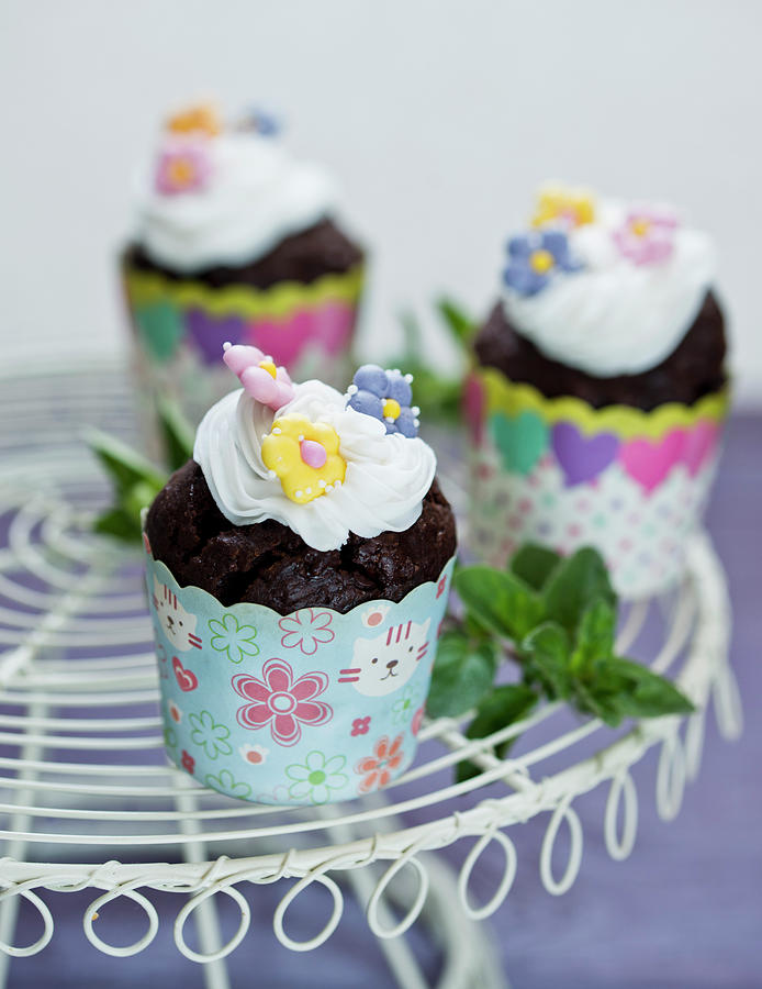 Chocolate Cupcakes With Flowers Decoration Photograph by Dorota Indycka