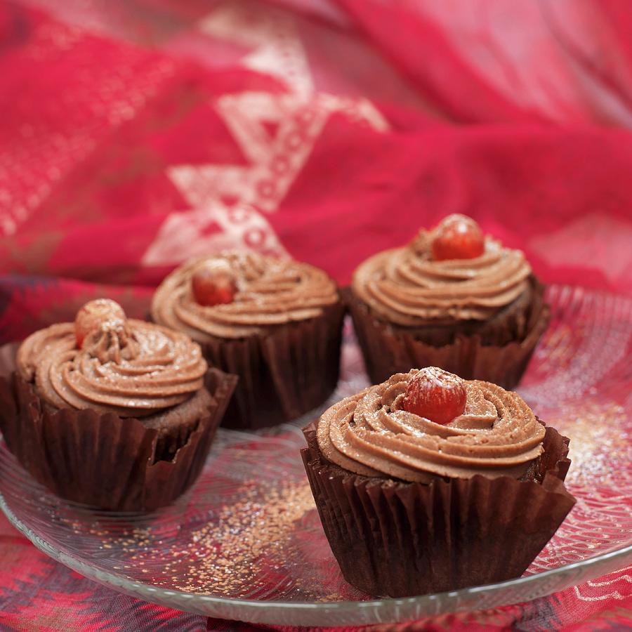 Chocolate Cupcakes With Glac Cherries On A Glass Plate Photograph by Elmira Watts