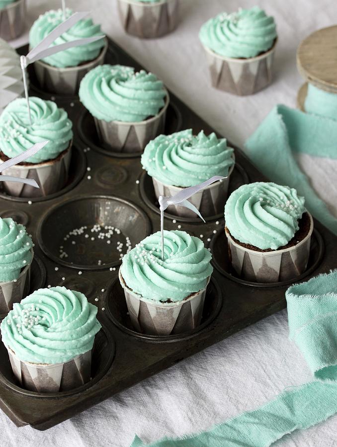 Chocolate Cupcakes With Mint-coloured Frosting Photograph by Emma Friedrichs
