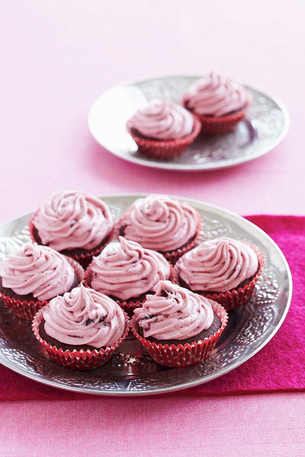Chocolate Cupcakes With Raspberry Cream Photograph by Charlotte Tolhurst