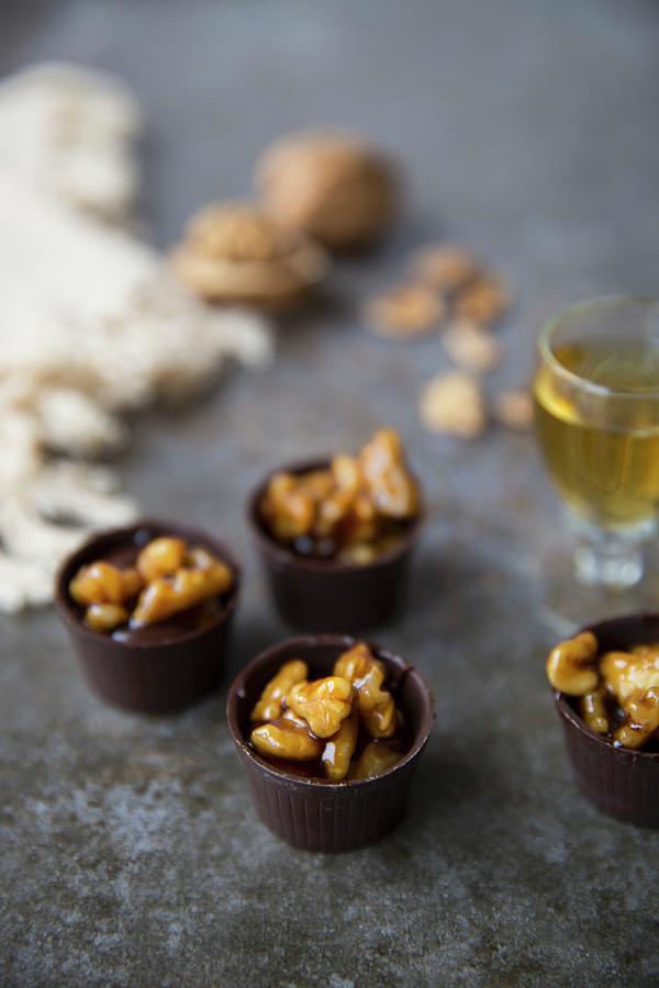 Chocolate Cups With Caramelized Walnuts Served With Liqueur Photograph by Joana Leito