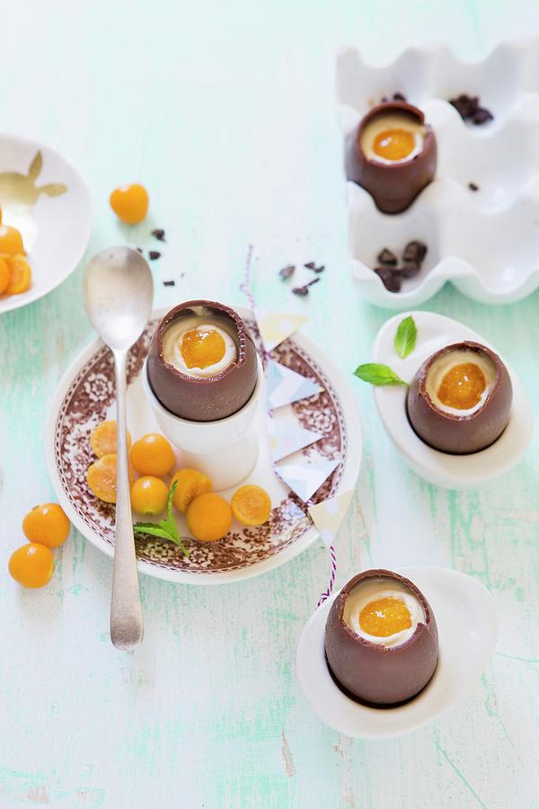 Chocolate Eggs Filled With Cheesecake And Physalis Photograph by Great Stock!