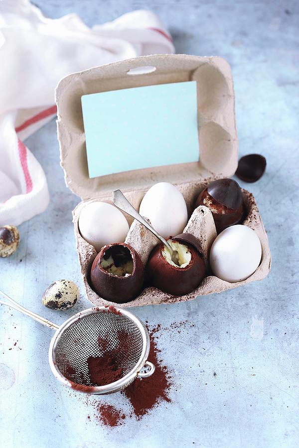 Chocolate Eggs Filled With Egg Cream And Vanilla Pudding Photograph by Zita Csig