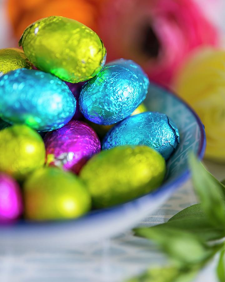 Chocolate Eggs Wrapped In Colourful Foil Photograph by Stuart Cox