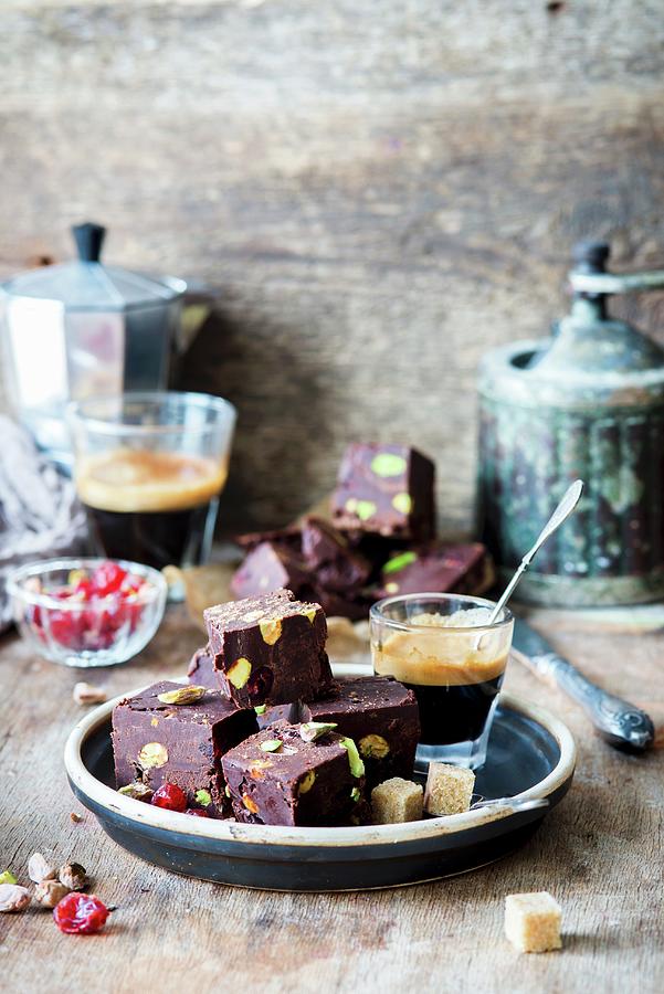 Chocolate Fudge With Pistachios, Sprinkled With Cherries, And Served With Coffee Photograph by Irina Meliukh