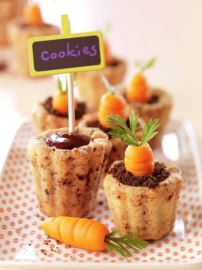 Chocolate Ganache And Oreo Biscuit Powder-carrot Easter Cookies In Almond Casings Photograph by Goumard