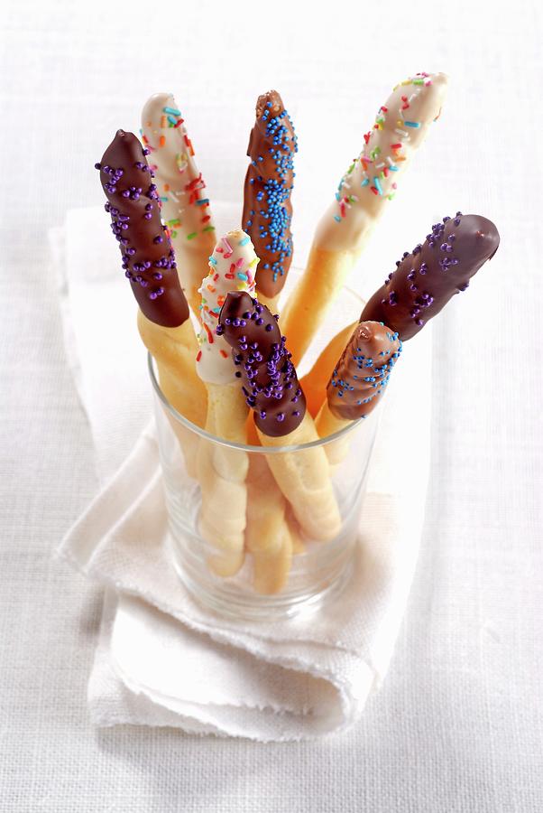 Chocolate Glazed Breadsticks With Sprinkles Photograph by Franco Pizzochero