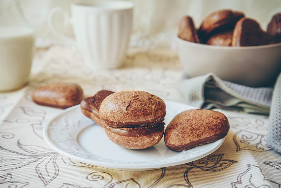 Chocolate Glazed Soft Gingerbread Cookies On A White Plate, Bowl Of Cookies, And Milk Photograph by Albina Bougartchev