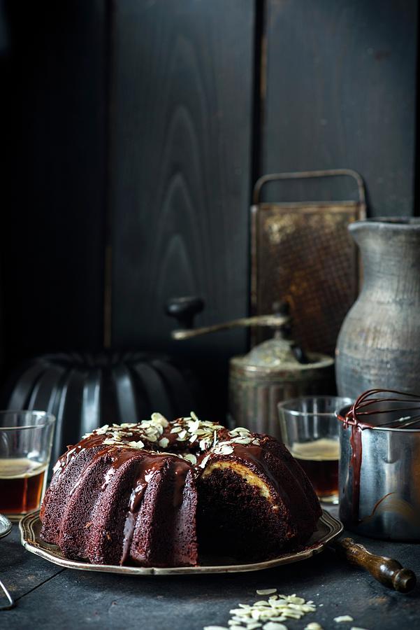 Chocolate Gugelhupf With A Fresh Cheese Filling And Ganache Photograph by Irina Meliukh