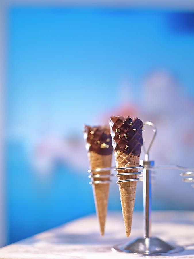 Chocolate Ice Cream Cones In A Cone Holder Photograph by Jalag / Michael Holz