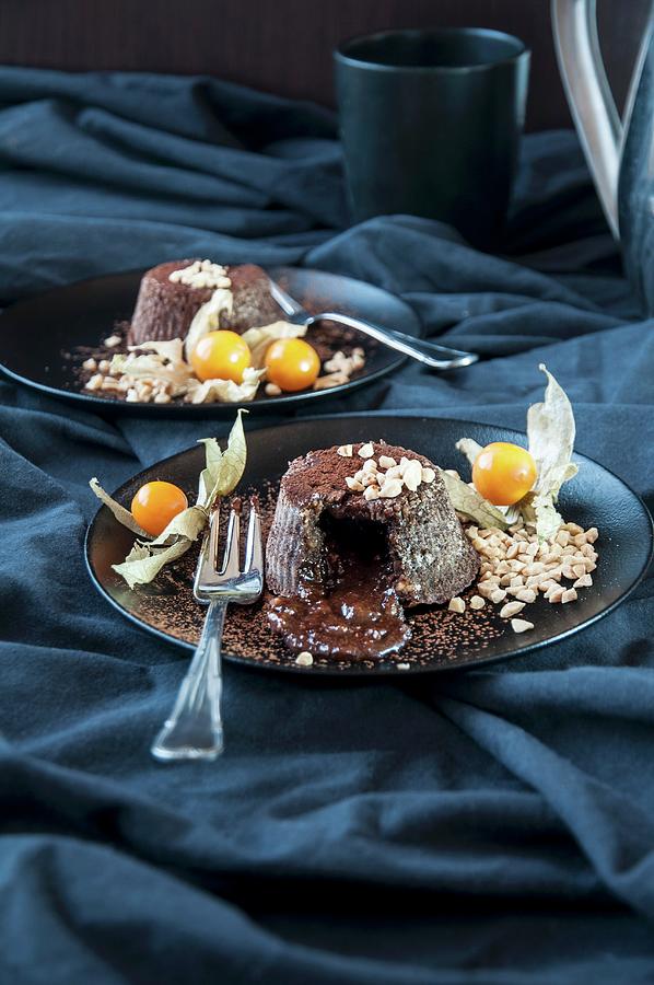 Chocolate Lava Cakes With Almonds And Physalis Photograph by Healthylauracom