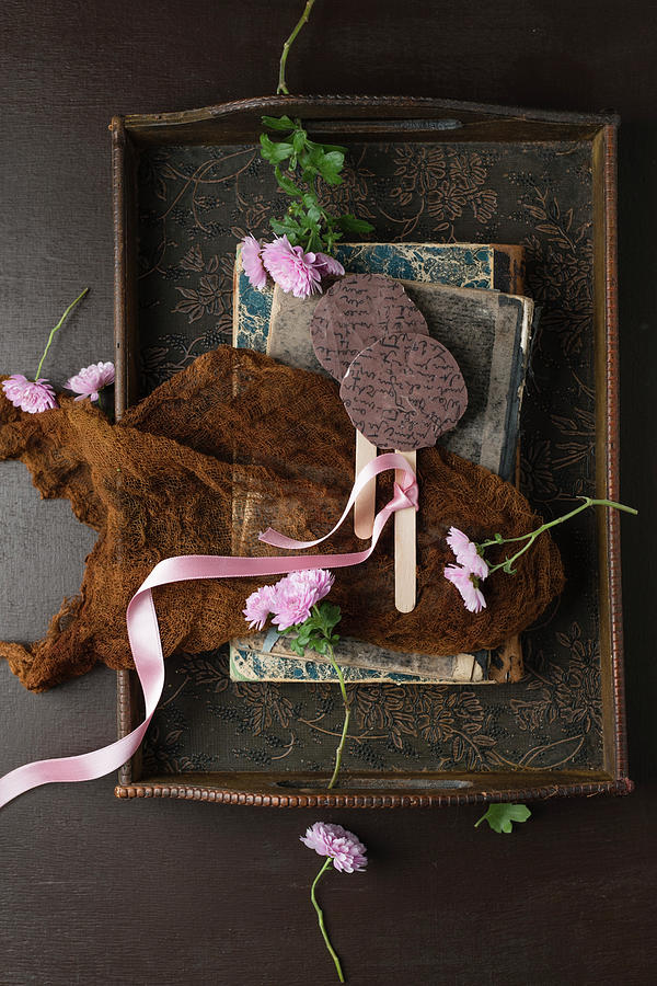 Chocolate Lollies, Books And Asters On Antique Wooden Tray Photograph by Mandy Reschke