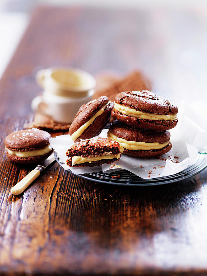 Chocolate Macarons With Vanilla Cream Photograph by Karen Thomas
