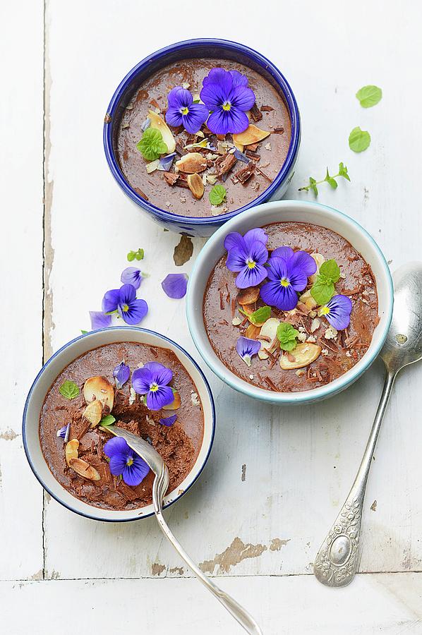 Chocolate Mousse With Almonds, Hazelnuts, Pansies And Mint Photograph by Keroudan