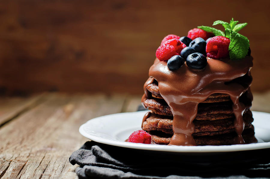 Chocolate Pancake With Blueberries, Raspberies And Chocolate Sauce Photograph by Natasha Arz