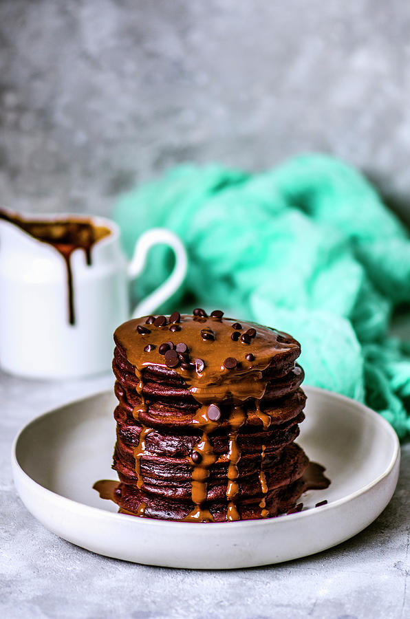 Chocolate Pancakes With Chocolate Drops And Chocolate Sauce Photograph by Gorobina