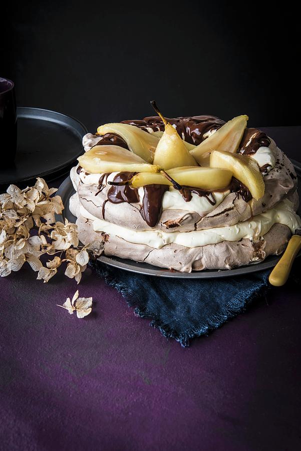 Chocolate Pavlova With Poached Pears, Dark Chocolate And Cream Photograph by Magdalena Hendey