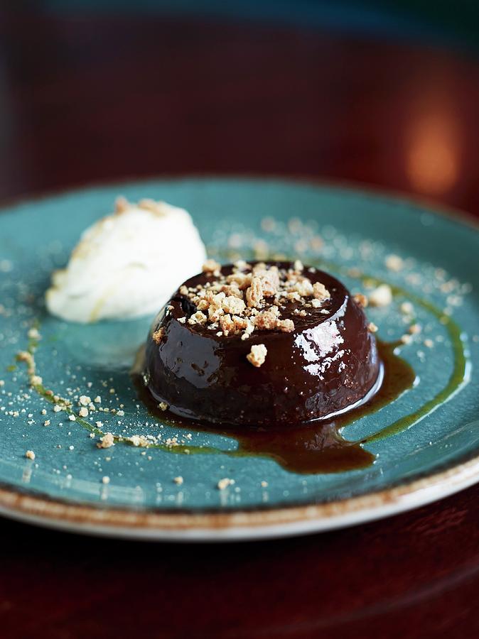 Chocolate Pudding With Amaretti And Chopped Nuts Photograph by Charlie Richards