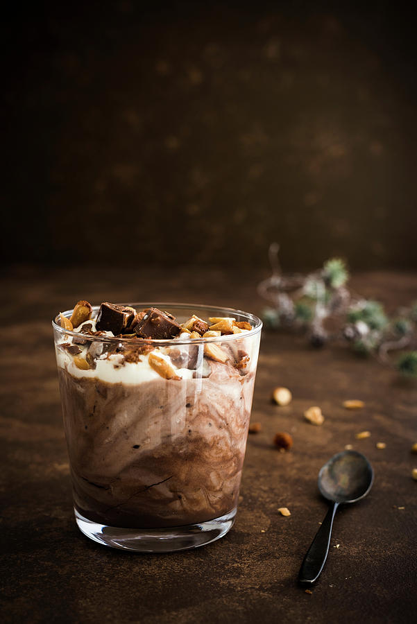 Chocolate Pudding With Roasted Nuts And Cream In A Glass Photograph by M. Nlke